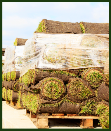 A stack of sod rolls wrapped in plastic.