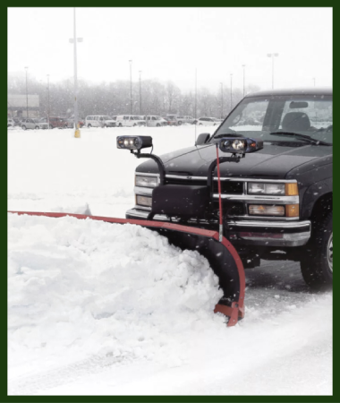 A snow removal truck is clearing snow.